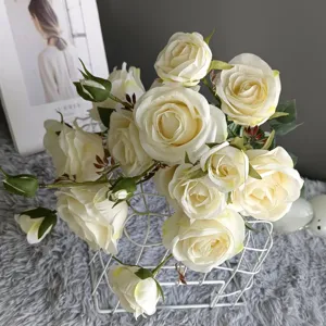 Artificial white rose bouquet in a white wire basket, perfect for Nordic home decor.