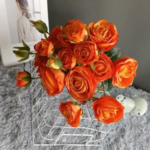 Artificial orange rose bouquet with scorched edges, handmade faux silk flowers for home decor.
