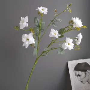 White artificial wild rose flower branch for home decor and floral arrangement details.