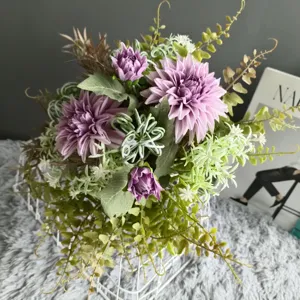 Artificial purple dahlia flower bouquet with green leaves in white wire basket for home decor