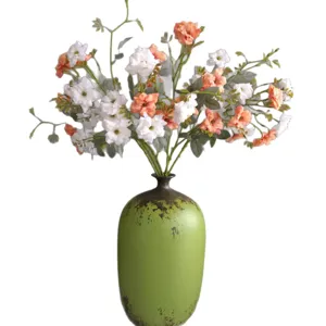 Artificial rose flowers bouquet in vintage green vase for home decor wedding decoration