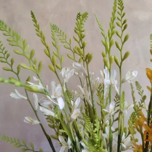 Artificial freesia and mock orchid flower branches for elegant home decor and wedding photography props.