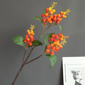 Artificial foam berry branch detail, vibrant red yellow gradient fruit for home decor.