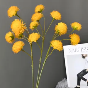 Artificial yellow pompom flower branch dandelion home decor wedding floral arrangement detail shot