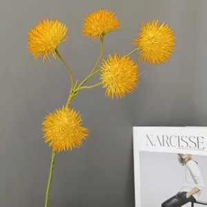 Artificial yellow allium flower branch detail shot for home decor and wedding arrangement.
