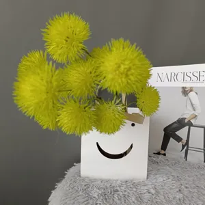 Vibrant artificial yellow spiky ball flowers bouquet for home decoration and wedding setup.