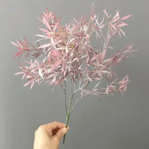 Detailed view of artificial pink flocked clover grass branch, ideal for floral decor.