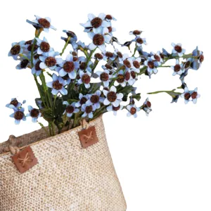 Artificial blue daisy flower bouquet in woven basket Nordic home decor photography props