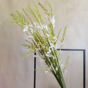 Detail view of artificial long stem white flower branches for home decor and photography.