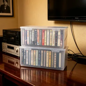 Clear plastic cassette storage box detail, showing stacked organizer boxes filled with tapes.