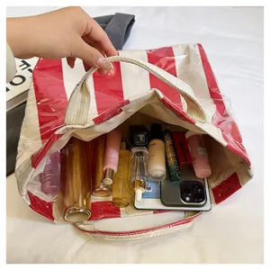 Large capacity striped canvas tote bag interior view showing spacious storage for daily essentials.