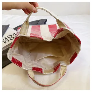 Red and white striped coated canvas beach tote bag, large capacity women handbag detail.