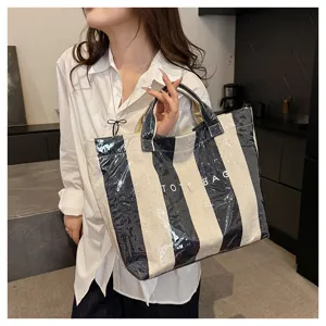 Color-block striped coated canvas tote bag, large capacity stylish beach bag for daily use.