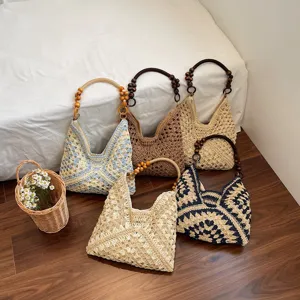 Handmade crochet straw shoulder bag with wooden bead handle, hollow beach hobo bag for women.