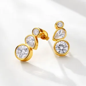 Gold-toned multi-stone drop earrings detail, featuring alternating round and pear crystal stones.