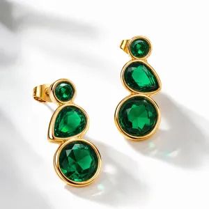 Exquisite simulated emerald drop earrings with three-stone design in polished gold finish.