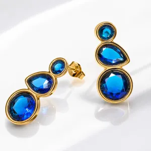 Exquisite gold-plated blue crystal earrings, detailed teardrop and round stone design closeup.