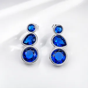 Exquisite triple-stone blue gemstone silver drop earrings, elegant retro fashion jewelry design.
