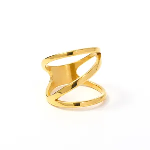 Gold irregular multi-layer ring detail close up, minimalist fashion chic finger jewelry.