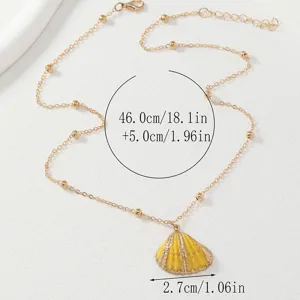 Gradient color shell necklace with gold rim scallop pendant and beaded chain, detail view.