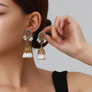 Vintage ethnic rhinestone pearl tassel jhumka earrings close up detail shot chic design