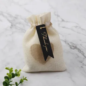 Rustic burlap gift pouch featuring black thank you tag and heart design for party favors.