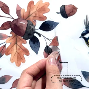 Autumn leaves and acorns window sticker detail showing double-sided colorful pattern design.