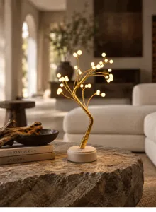 Detailansicht der eleganten goldenen LED-Dekobaumleuchte für eine gemütliche Atmosphäre.