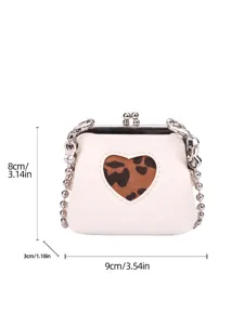 Mini white kiss-lock shoulder bag with leopard heart cutout and metallic ball chain strap.