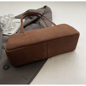 Minimalist brown suede baguette shoulder bag for women, chic vintage underarm design.