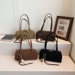 Minimalist suede baguette shoulder bag for women, chic underarm purse with lovely pendant design.