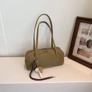Minimalist suede baguette shoulder bag for women, stylish vintage underarm bag with cute charms.