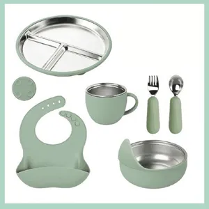 Stainless steel silicone baby feeding set with divided plate, bowl, cup and cute bib.