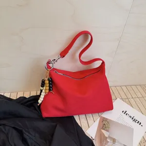 Stylish red suede underarm shoulder bag for women, trendy minimalist hobo handbag for daily use.