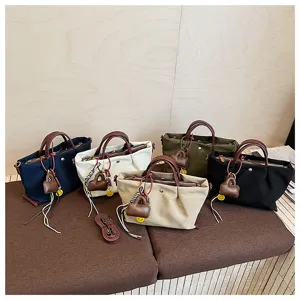 Nylon crossbody shoulder tote bags detail showcasing multiple color options and charms.