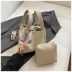 Detailed view of trendy Korean style bucket bag with small pouch and cute pegasus charm.