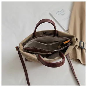 Detailed view of women's nylon shoulder bag interior structure with compartments and zipper.