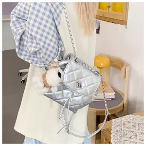 Stylish silver quilted chain backpack with cute puppy pendant for trendy daily casual wear.