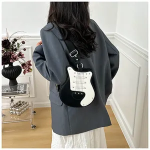 Unique guitar shaped crossbody bag for women, stylish black and white novelty shoulder bag detail.