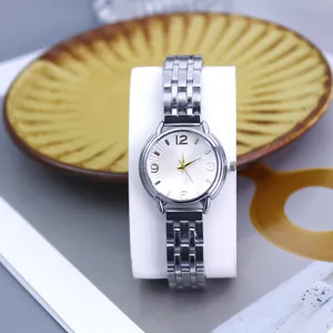 Women fashion steel strap quartz watch with radial pattern dial and digital markers.