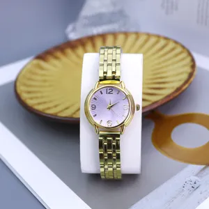 Women fashion quartz watch gold steel strap purple radial dial elegant timepiece detail