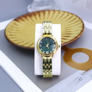 Women fashion quartz watch with gold steel strap and dark green dial for daily wear