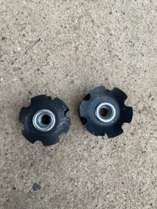 Bicycle fork star nut detail shot, 28.6mm headset compression plug accessory for mountain bikes.