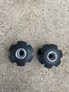 Closeup of bicycle front fork star nut 28.6mm headset star nut replacement part component.
