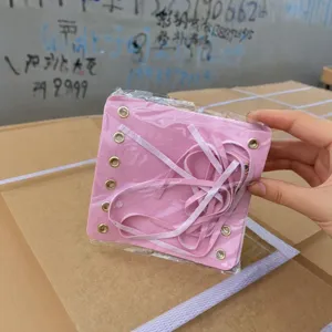 Pink leather lace-up decorative accessory panel with metal eyelets in clear package main view