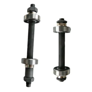 Detail shot of bicycle hollow axle and bearing assembly, showing solid metal construction.