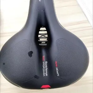 Ergonomic black bicycle saddle with central ventilation cutout, comfortable bike seat.