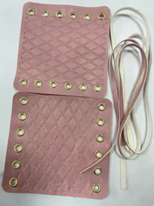 Pink leather motorcycle handlebar covers DIY parts with metal eyelets and laces.