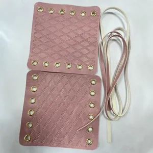 Pink quilted leather handlebar covers with metal eyelets and laces for retro bikes and e-bikes.