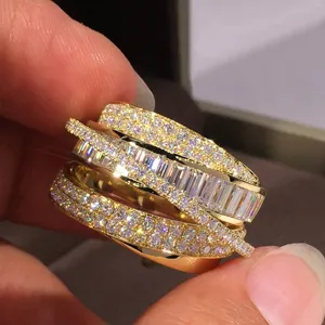 Luxury multi-row crossover ring with sparkling pavé and baguette stones for women.